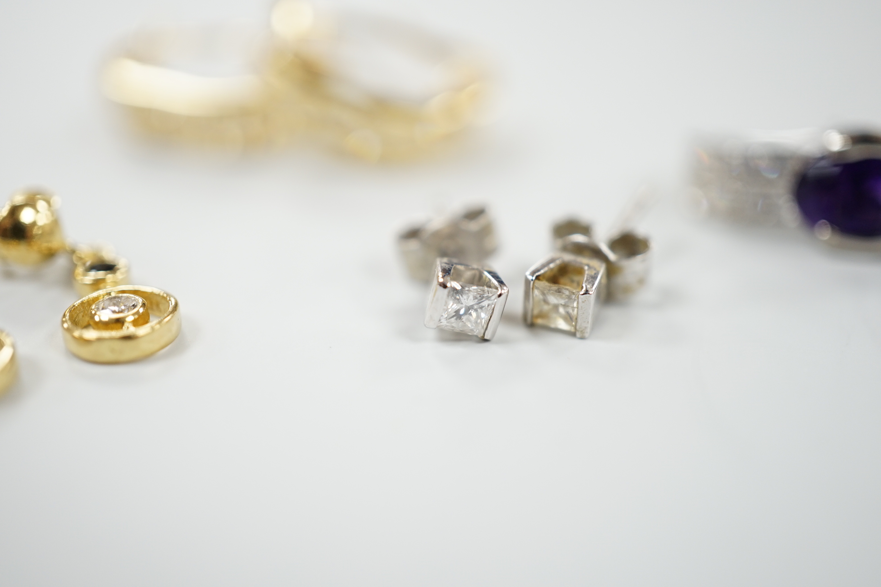 Four assorted modern pairs of 750 or 18ct gold and gem set earrings, including small solitaire diamond and two row diamond chip half hoop, 16mm, gross weight 10.1 grams.